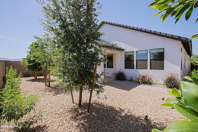 back of property with a patio