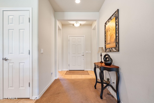 hallway featuring light tile patterned flooring