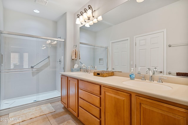 bathroom with vanity, tile patterned floors, and walk in shower