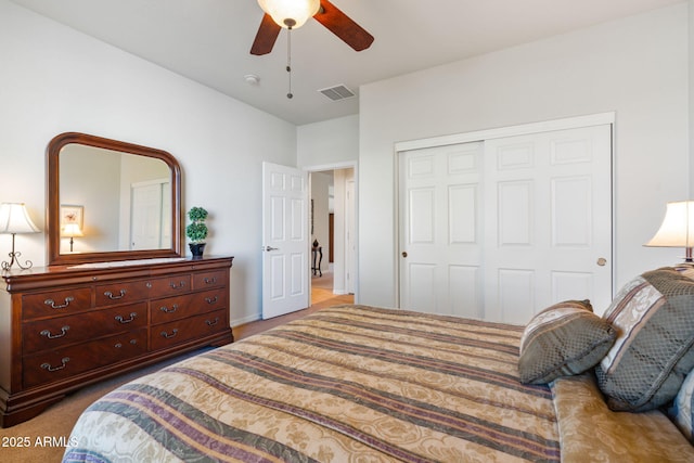 bedroom with carpet flooring, ceiling fan, and a closet