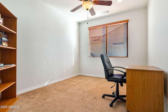 carpeted office with ceiling fan