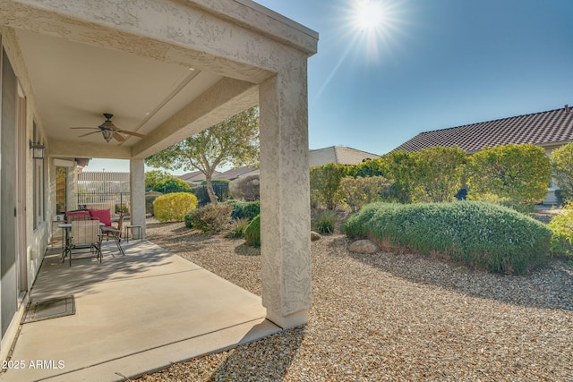 view of patio featuring ceiling fan