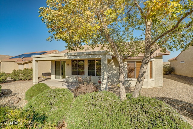 back of property with a patio area