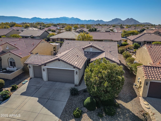 drone / aerial view featuring a mountain view