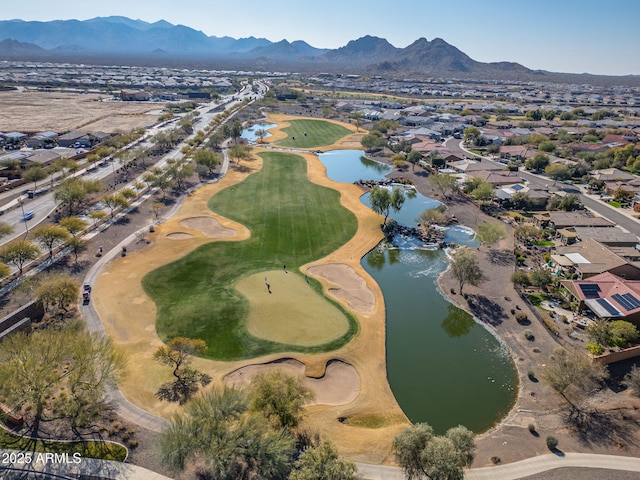 birds eye view of property featuring a water and mountain view