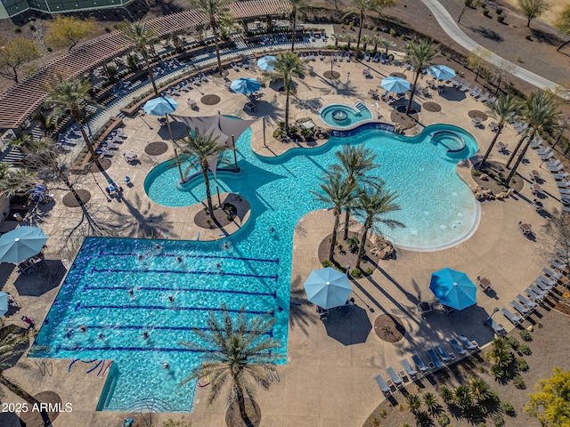 view of pool with a hot tub