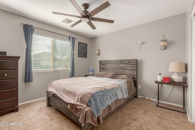 bedroom with ceiling fan and light carpet