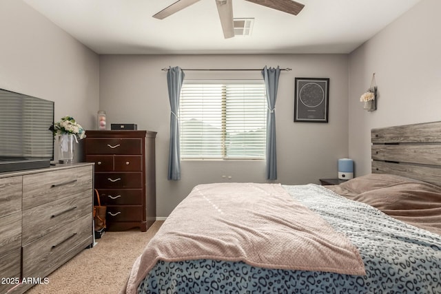 bedroom featuring ceiling fan and light colored carpet