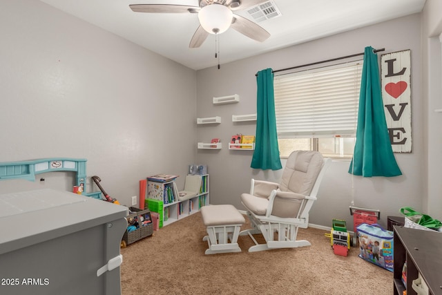 playroom with carpet and ceiling fan