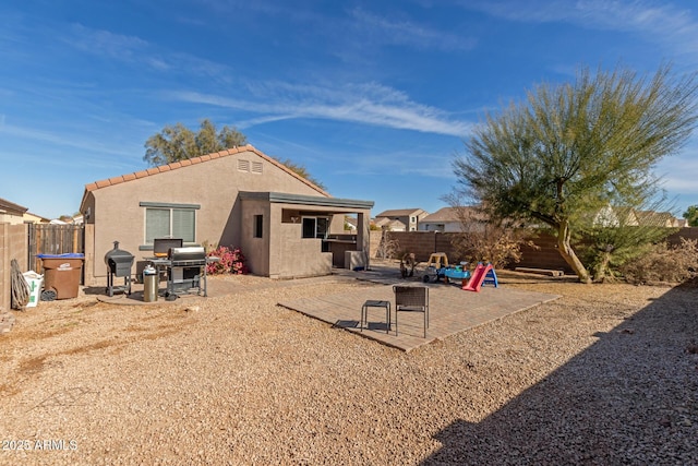 back of property with a patio area