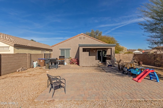 back of property with a patio area