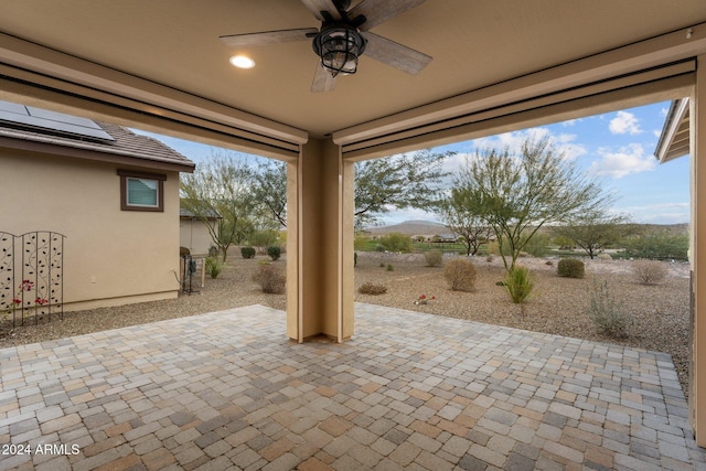 view of patio / terrace featuring ceiling fan