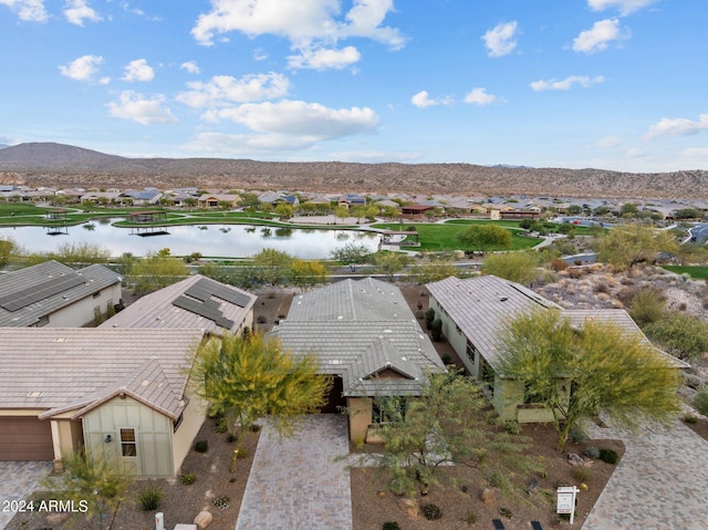 bird's eye view with a water and mountain view