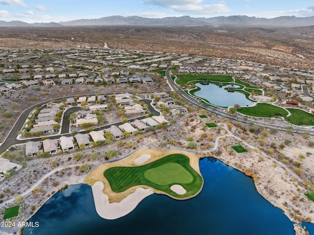 drone / aerial view featuring a water and mountain view