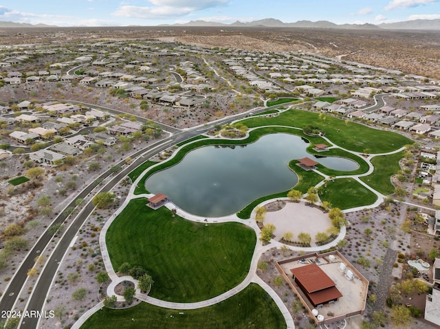 drone / aerial view with a water and mountain view