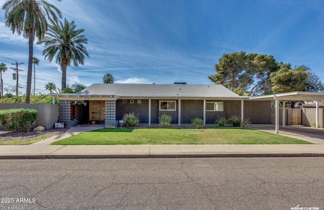 single story home with a carport and a front yard