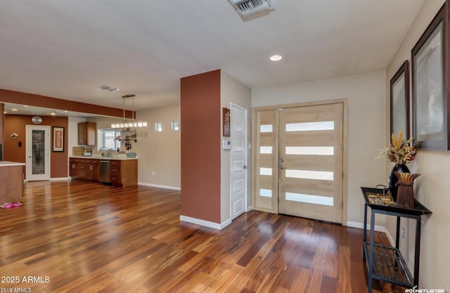 entryway with sink and dark hardwood / wood-style flooring