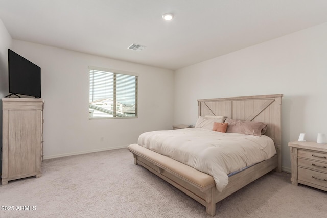 bedroom featuring light carpet