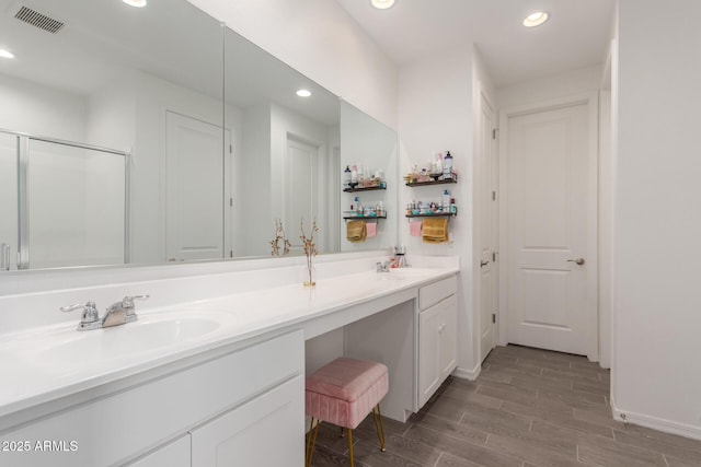 bathroom featuring vanity and walk in shower