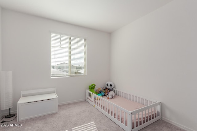 bedroom with light carpet and a crib