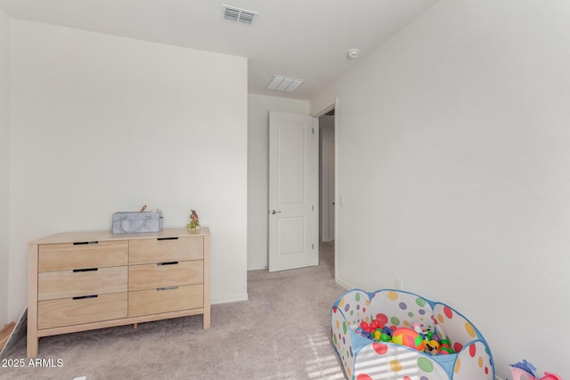 recreation room with light colored carpet