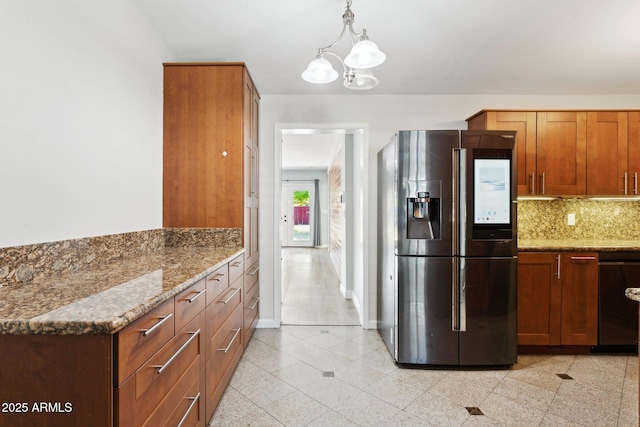kitchen featuring fridge with ice dispenser, light stone countertops, tasteful backsplash, a chandelier, and black dishwasher