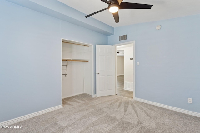 unfurnished bedroom featuring carpet floors, a closet, a ceiling fan, and baseboards