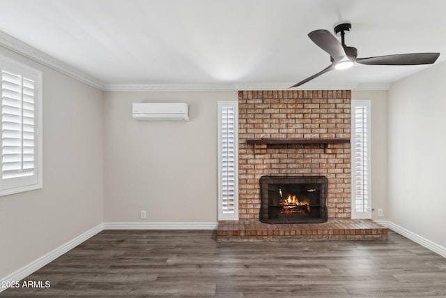 unfurnished living room featuring a wall mounted AC, ceiling fan, wood finished floors, and plenty of natural light