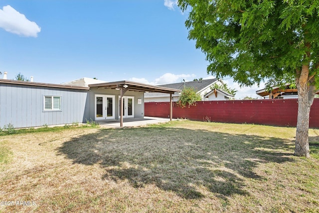 rear view of house with french doors and a patio