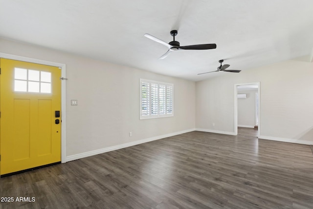 entryway with a ceiling fan, dark wood-type flooring, and baseboards