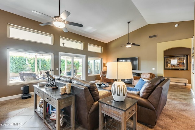 living room with high vaulted ceiling, ceiling fan, and light tile patterned flooring