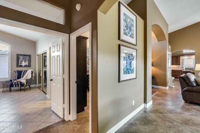 corridor featuring light tile patterned floors