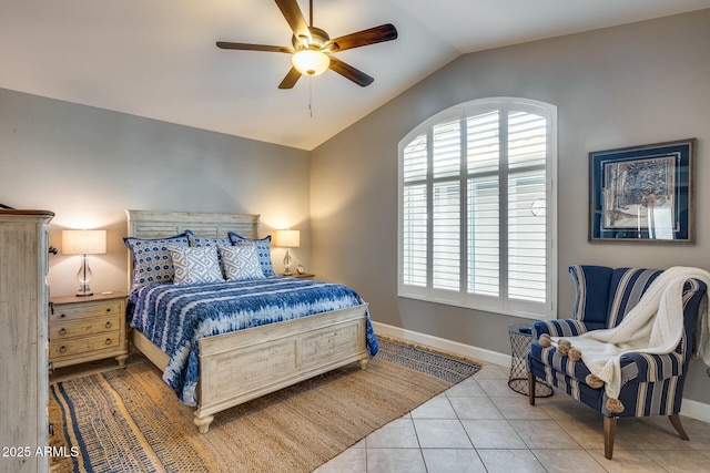 tiled bedroom with lofted ceiling and ceiling fan