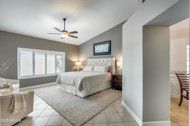 tiled bedroom featuring lofted ceiling and ceiling fan