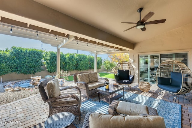 view of patio featuring ceiling fan and an outdoor living space