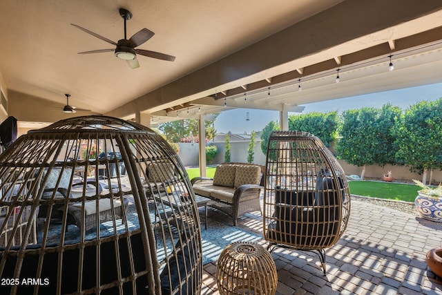 exterior space featuring ceiling fan and an outdoor living space