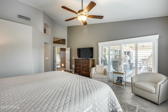 tiled bedroom with vaulted ceiling and ceiling fan