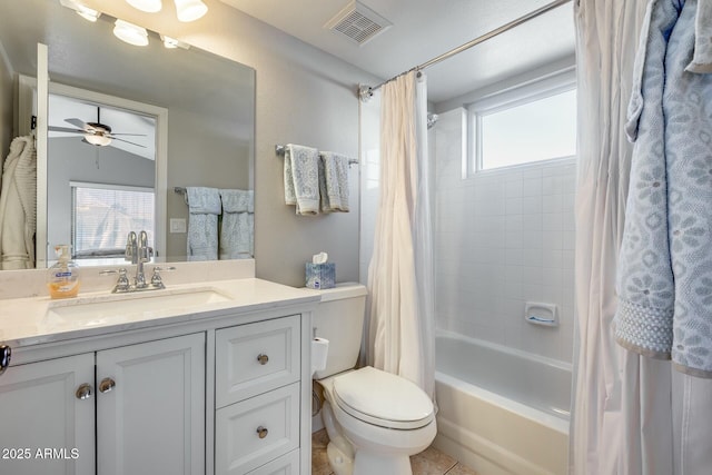 full bathroom featuring vanity, ceiling fan, shower / bath combination with curtain, and toilet