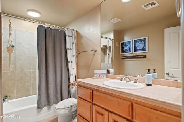 full bathroom with shower / bath combo, tile patterned flooring, vanity, and toilet