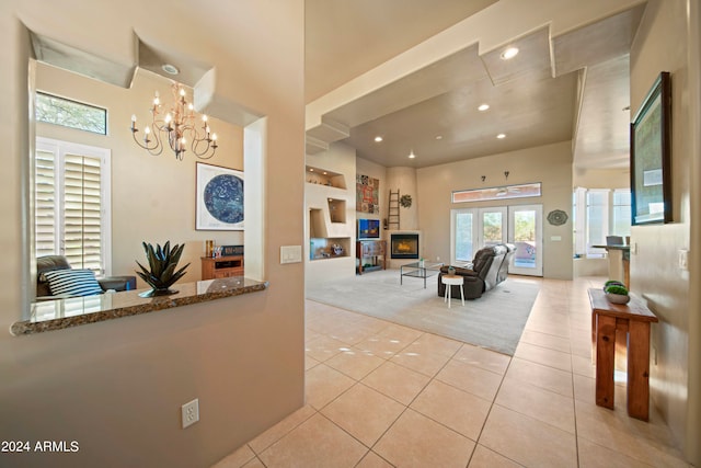 interior space featuring light tile patterned flooring and an inviting chandelier