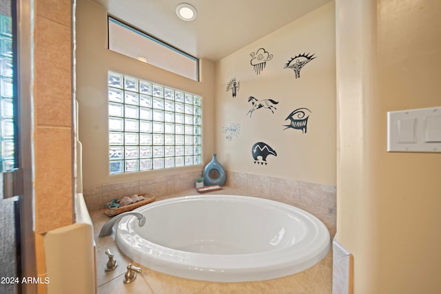 bathroom with tiled tub