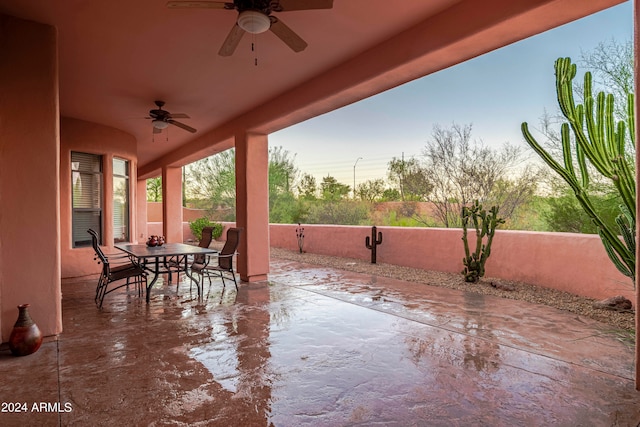 patio terrace at dusk with ceiling fan