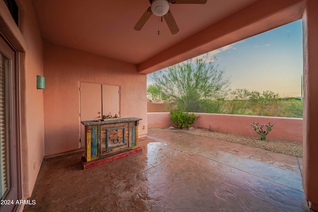 patio terrace at dusk with ceiling fan