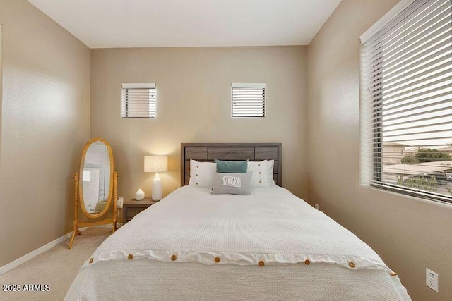 3330 S Gilbert Rd Unit 2090, Chandler, AZ 85286 - bedroom with baseboards, multiple windows, and light colored carpet