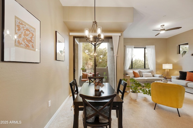 3330 S Gilbert Rd Unit 2090, Chandler, AZ 85286 - carpeted dining area featuring ceiling fan with notable chandelier and baseboards