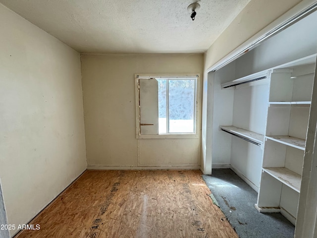 interior space featuring a textured ceiling