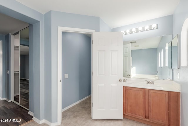 bathroom featuring vanity and wood-type flooring