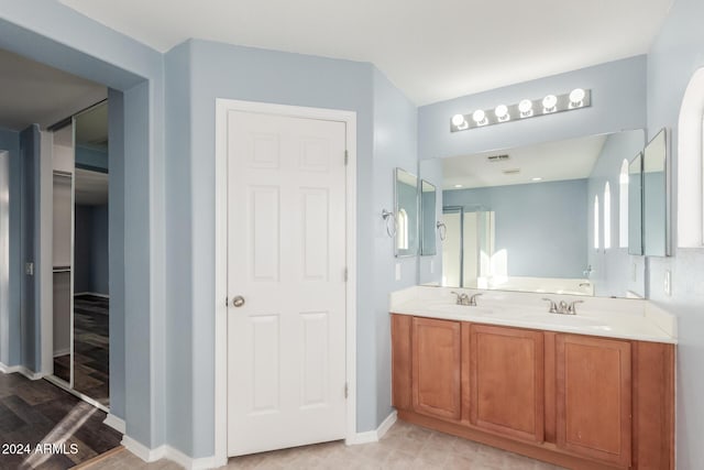 bathroom featuring hardwood / wood-style floors and vanity