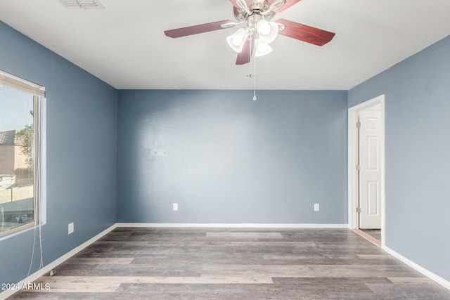 empty room with light hardwood / wood-style floors and ceiling fan