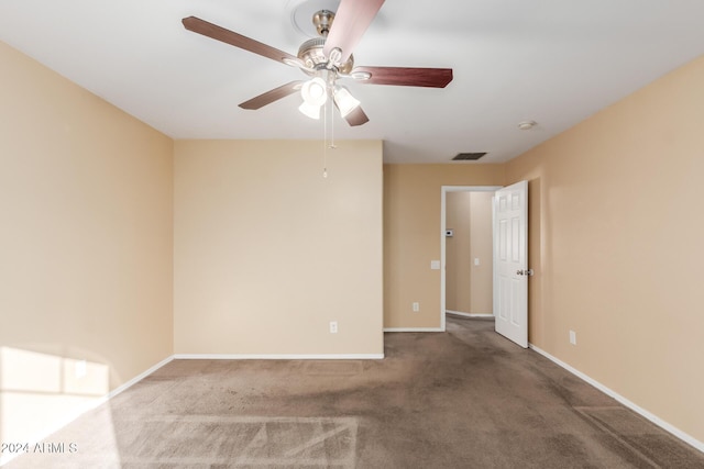 carpeted empty room featuring ceiling fan